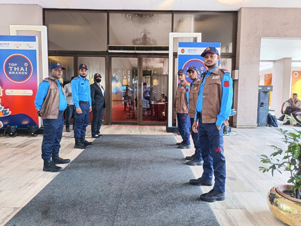 Professional security personnel from Complete Security Solution (C2S) providing event security services during the Top Thai Brands 2026 international exhibition at Pan Pacific Sonargaon Dhaka. The image showcases trained security guards managing access control, visitor safety, and crowd management at one of Bangladesh's prestigious international business events.